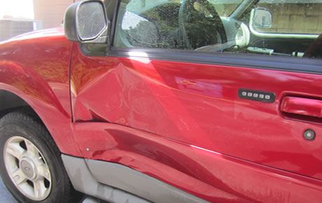 Drivers door took some damage  Dent removed and paint matched perfectly.